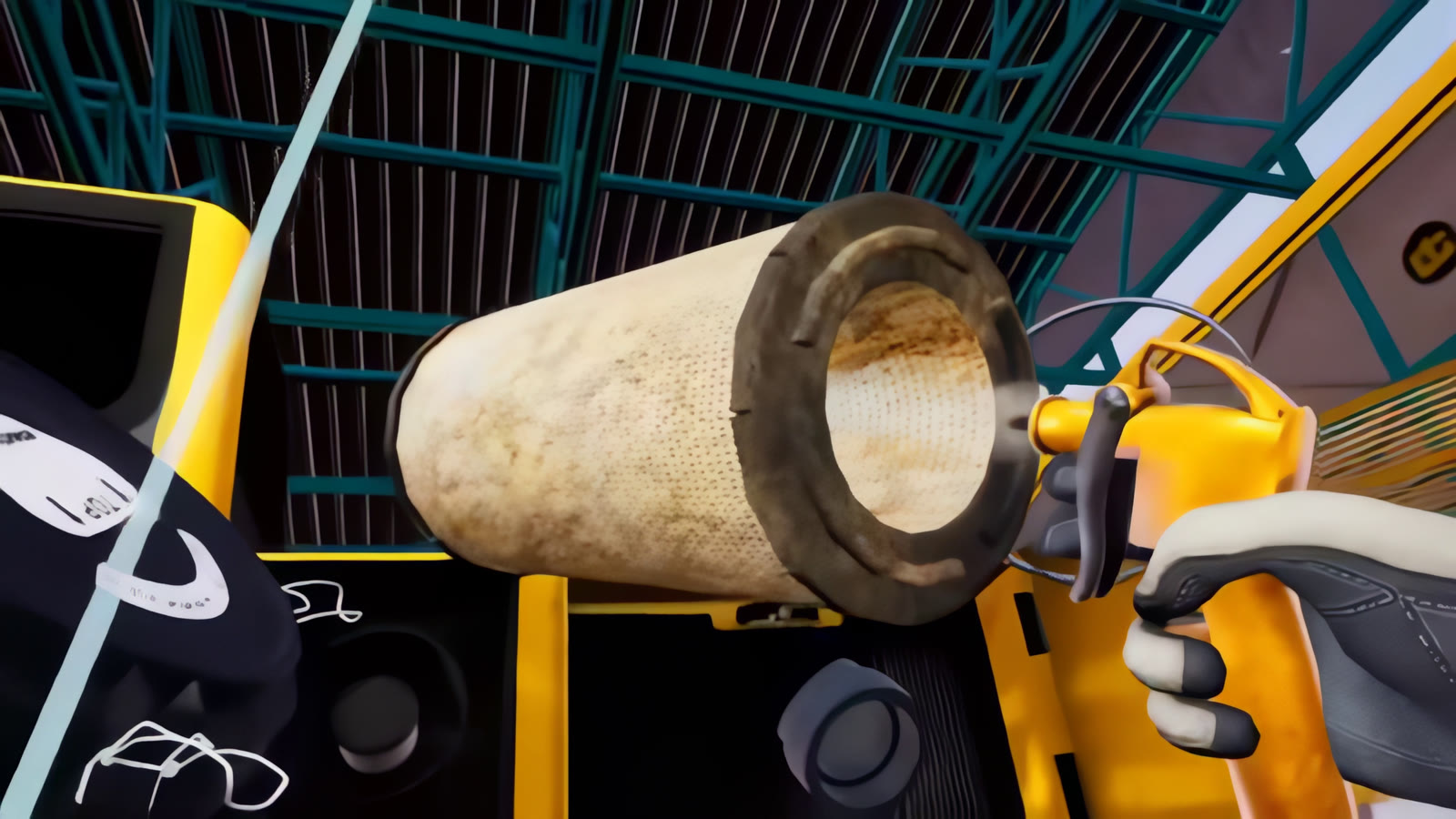 Air compressor nozzle aimed at a dusty air filter element to blow it clean, in the excavator maintenance trainer.